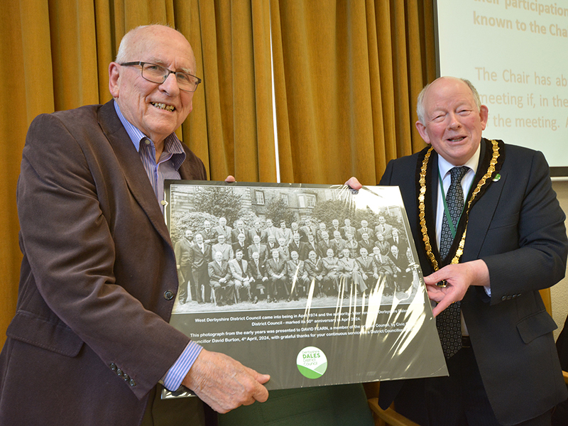 David Fearn receiving an old photo of the council from Councillor David Burton