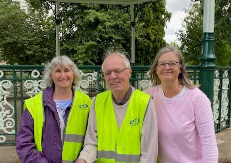 chair, treasurer and secretary of the committee taken in front of the Bandstand in Hall Leys Park, Matlock