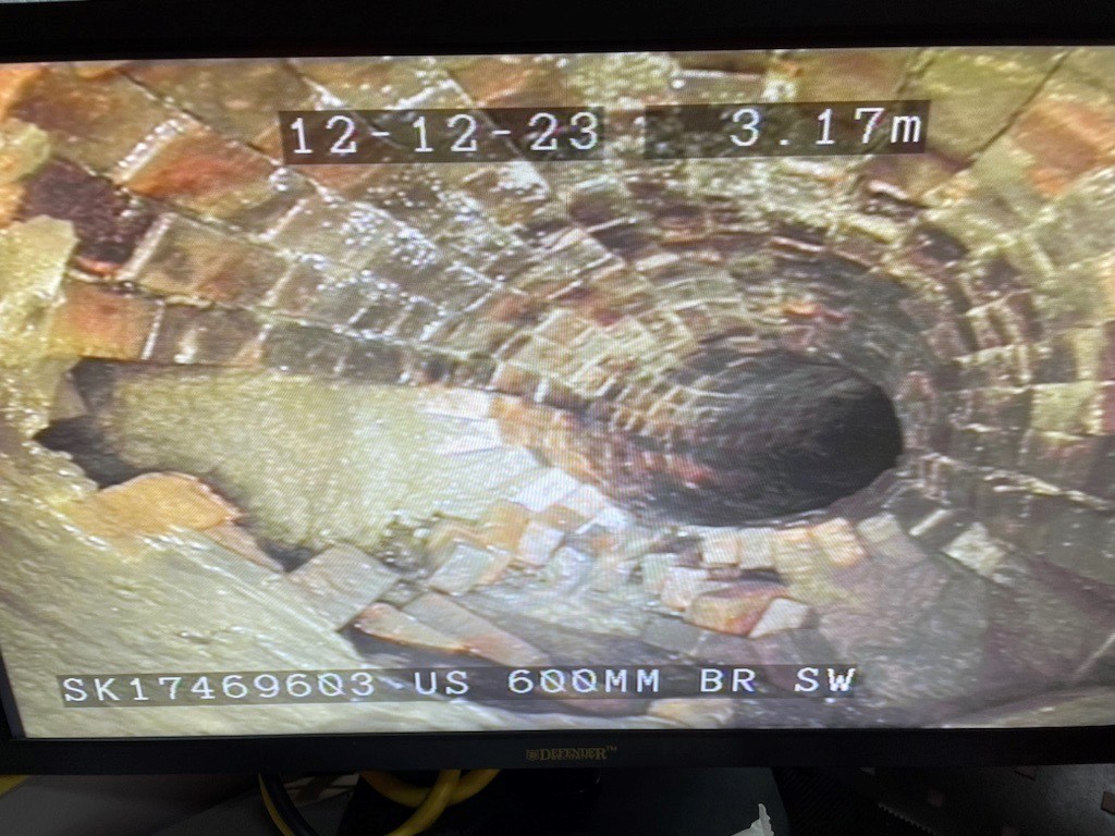 Robots-eye view inside underground tunnel made of bricks