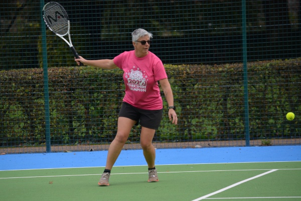 Lady playing tennis at Rusty Rackets