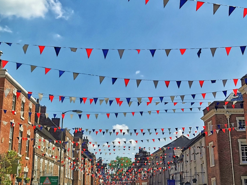 Ashbourne town centre with blue skies and bunting