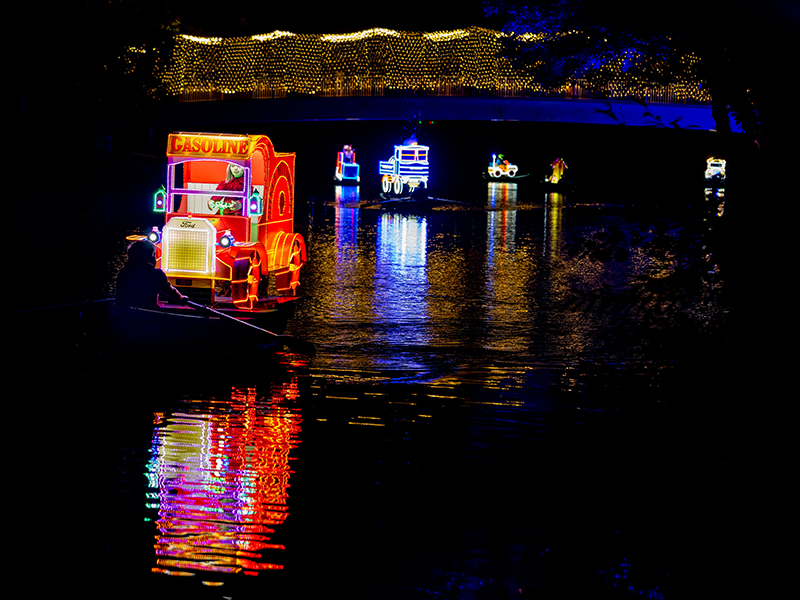 Decorated and illuminated boats on the River Derwent