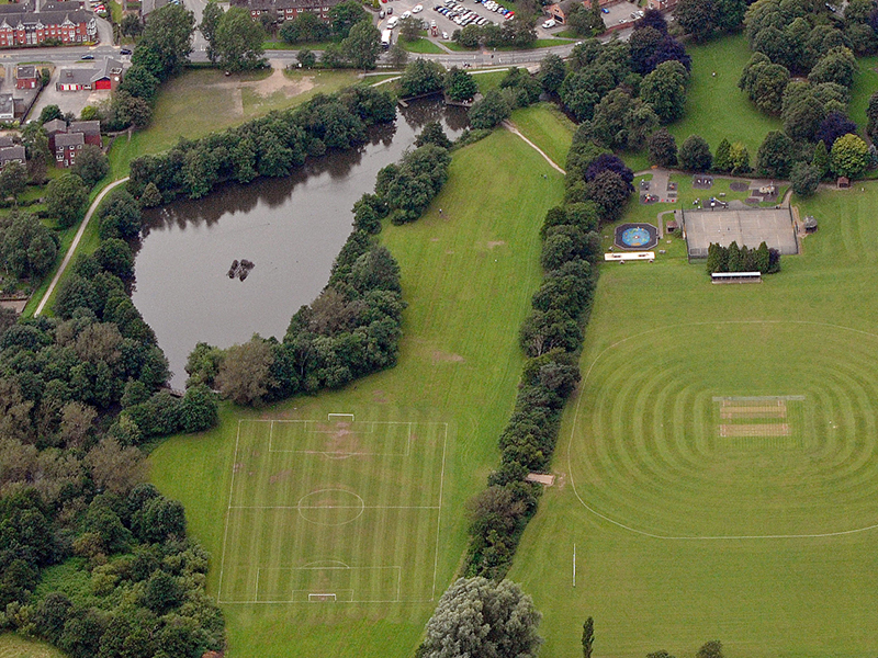 Overview of Fishpond Meadow including the pond and sports pitches
