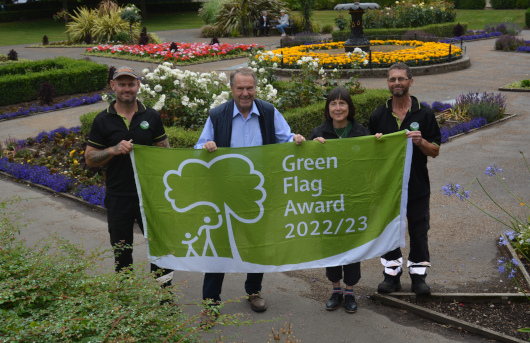 People holding Green Flag Award 2022-23