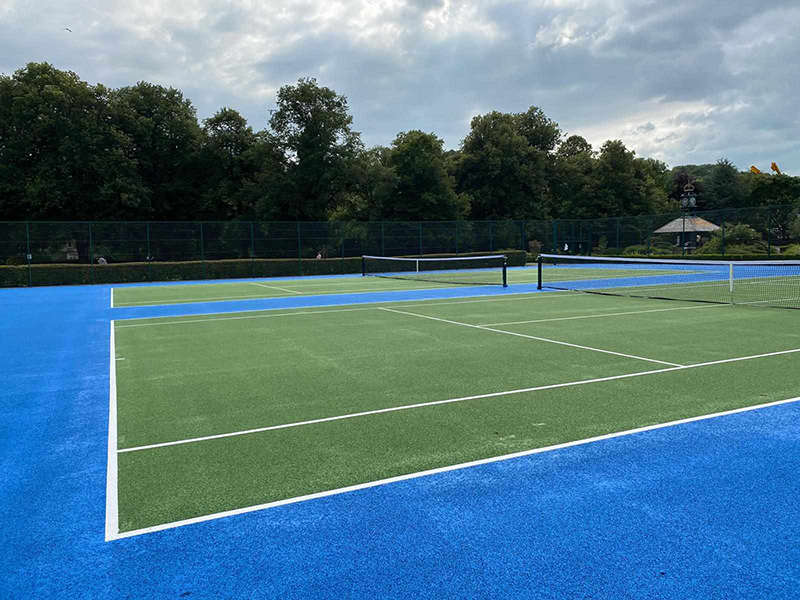 The refurbished tennis courts in Hall Leys park, painted blue and green