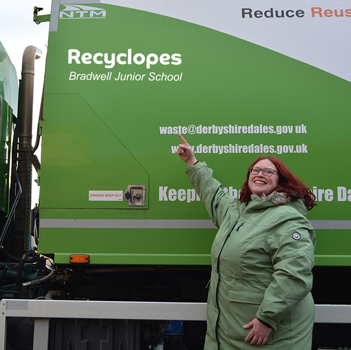 Kathryn McGuiness representing Bradwell Junior School points to the Recyclopes truck name