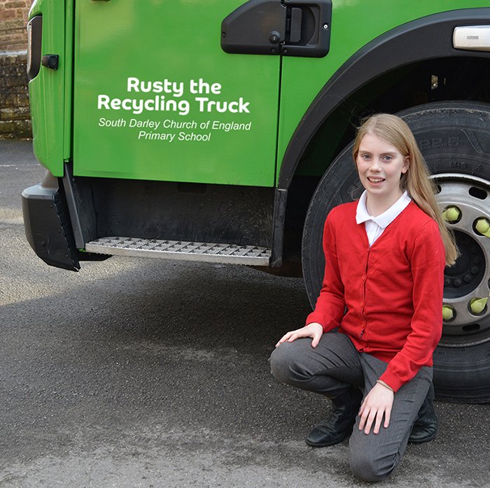  Emmy from South Darley Primary, pointing to their Rusty the Recycling Truck name