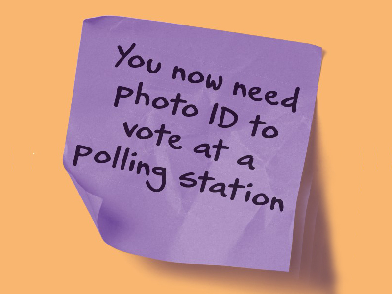 Purple piece of paper with the words You now need photo ID to vote at a polling station