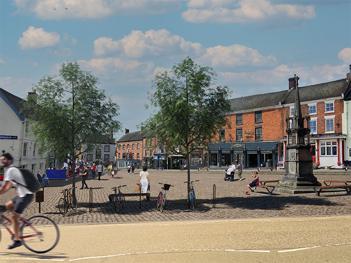 Artists impression of the Market Place, pedestrianised with cobbles, trees and bike stands