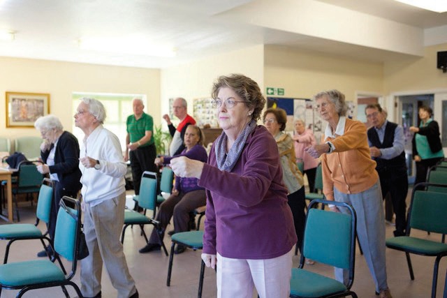 People doing standing exercises called Otago.